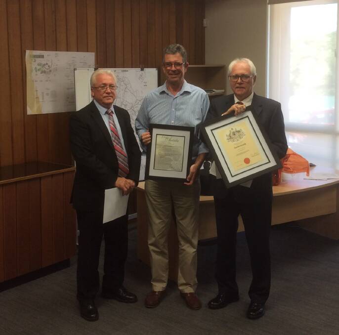 PROUD: David Grant (centre) flanked by Harden Shire Acting General Manager Trevor Drowley and Mayor John Horton (right).