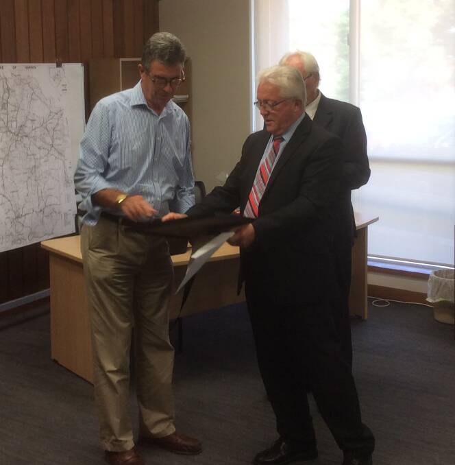 FULL CITIZEN OF AUSTRALIA: David Grant receives his certificate from Harden Shire Council Acting General Manager Trevor Drowley. Picture: John McLaurin.