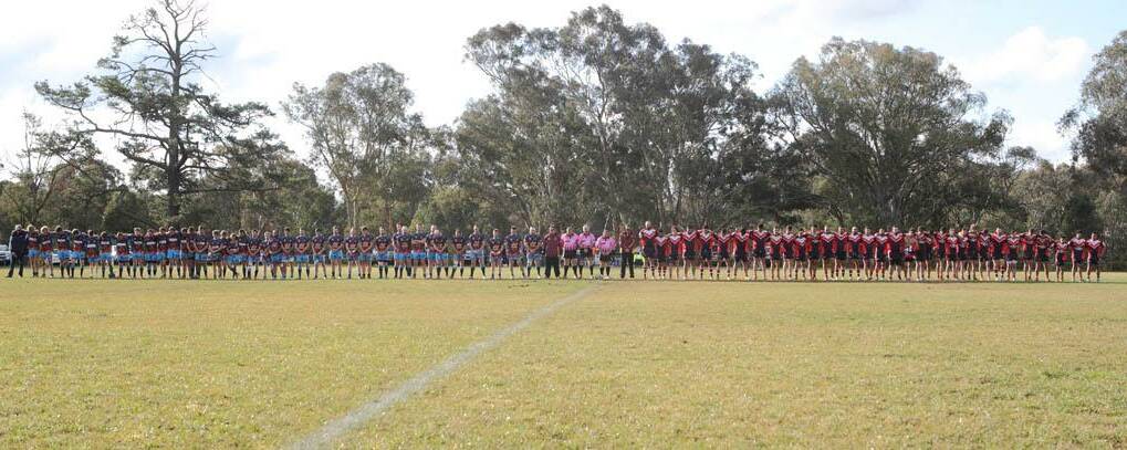 A MOVING TRIBUTE: Both teams before the start of play paid their respects to Goologong player Garry Smith who passed away last week. PICTURE: RS. Williams.