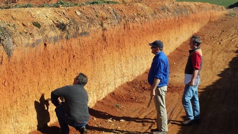 Mark Glover (left), Dr Ben Macdonald (right), and Harden-Murrumburrah Landcare Group’s Rob McColl (centre) discussing soil processes on Rob’s Binalong farm.