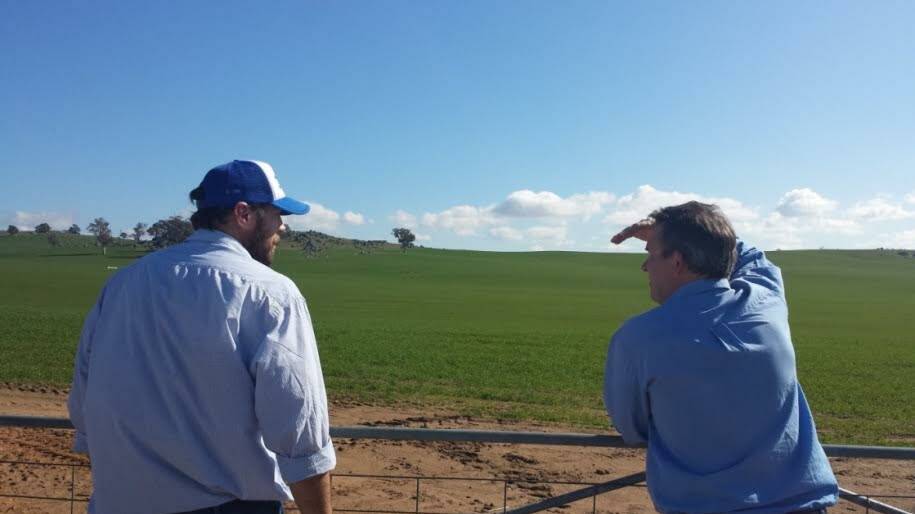 Harden-Murrumburrah Landcare Group member Adrian Roles (left) and CSIRO’s Mark Glover (right) discussing soil processes on the farm of Matt Ryan.