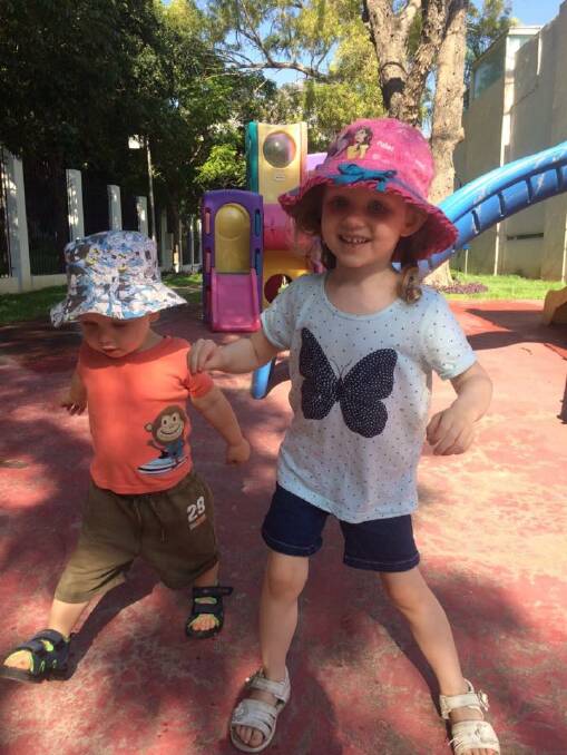 Annabelle Potts and her little brother William playing in the sun in Mexico, between Annabelle's intra-arterial infusions and immunotherapy treatments.
