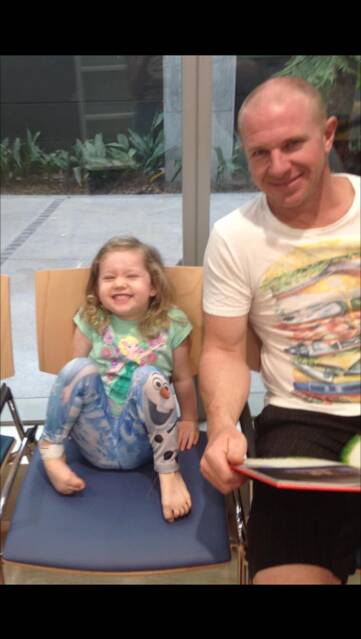 Always up for a giggle: Annabelle Potts with her father, Adam, celebrating her last  radiotherapy treatment last week.