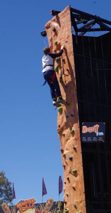 CLIMBING TO THE TOP: The free climbing wall was a huge hit with the teens