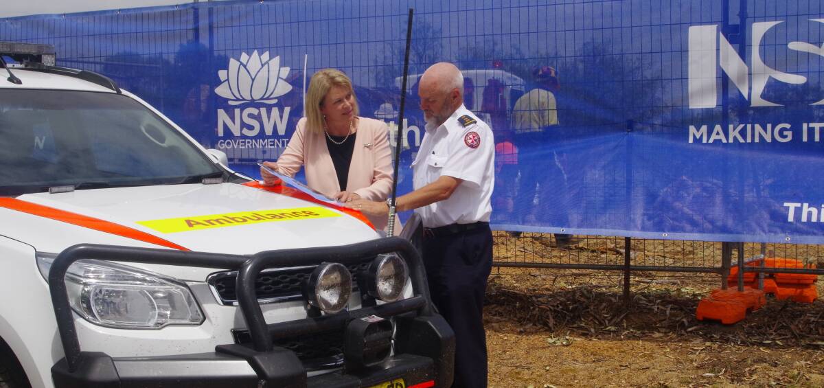 PLANS: Member for Cootamundra Katrina Hodgkinson and NSW Ambulance Inspector Martin Cutler, looking at the plans for the new ambulance station in Harden. 