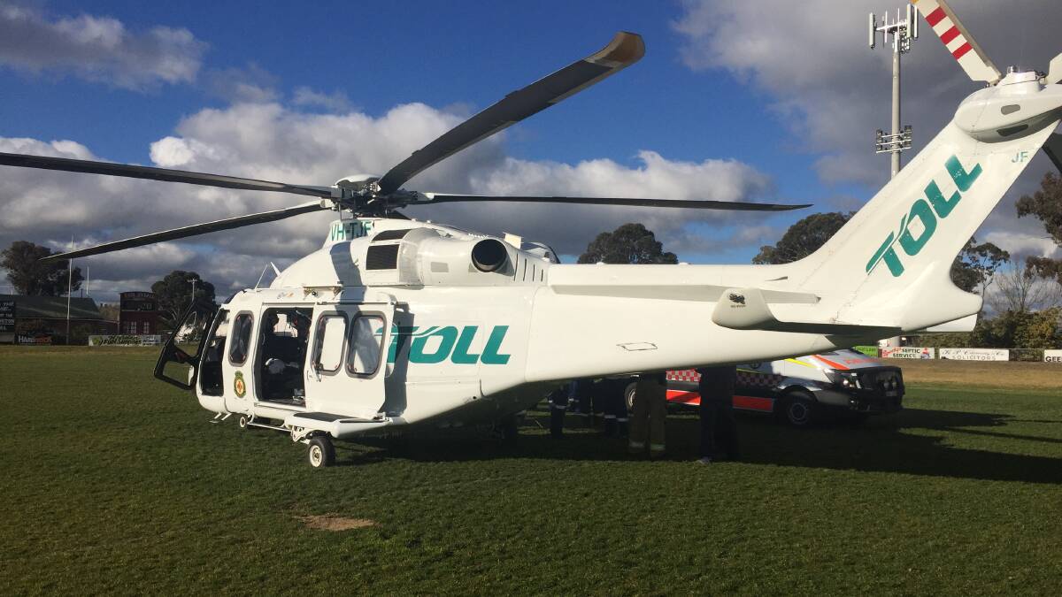 ACCIDENT: The Toll Careflight helicopter landed on McLean Oval to pick up the injured apprentice. Picture: Wal Leonow.