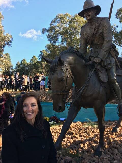 Donna Hampton with the Memorial on Anzac Parade in Canberra. 