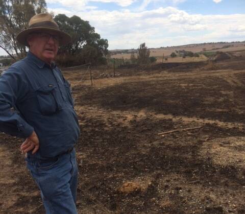 CLOSE CALL: Peter Holding, one of the three men who showed exceptional fire-fighting leadership last week, standing at the Jack Ward Drive site.