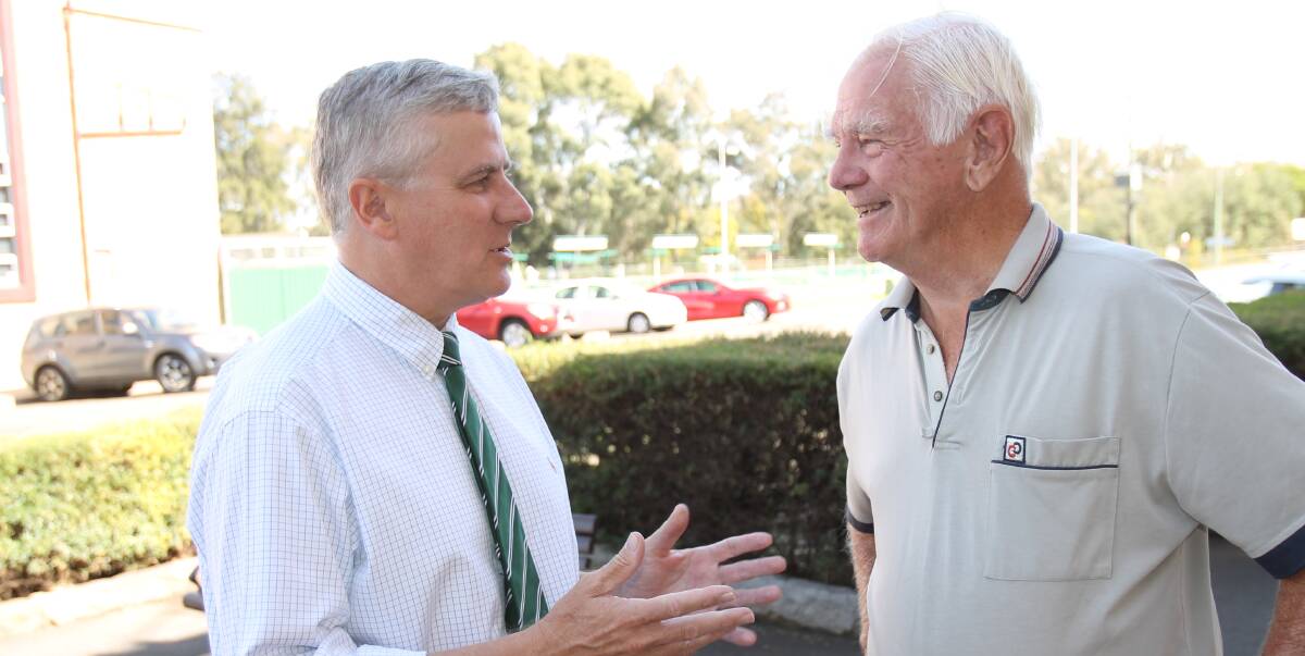 MEETING THE LOCALS: Riverina MP Michael McCormack stops to chat with Mike Forster during a visit to Cootamundra. Picture: Harrison Vesey