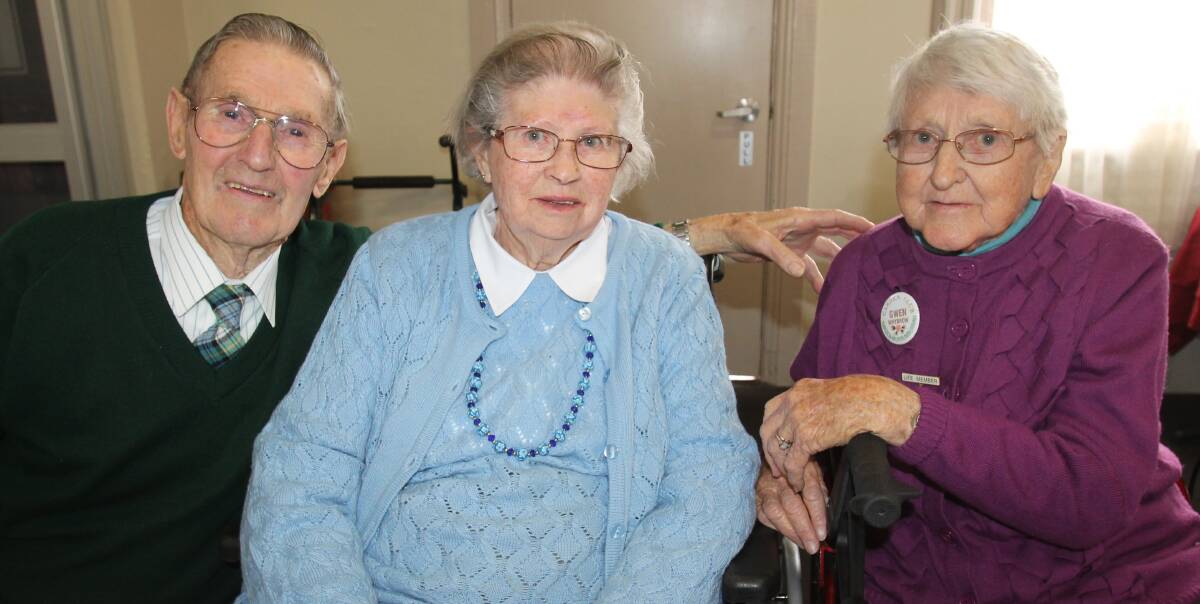 BLOOMING: Harden Murrumburrah Garden Club original member Gwen Whybrow (right) welcomed two new life members on Monday, George and Margaret Killick. Picture: Harrison Vesey