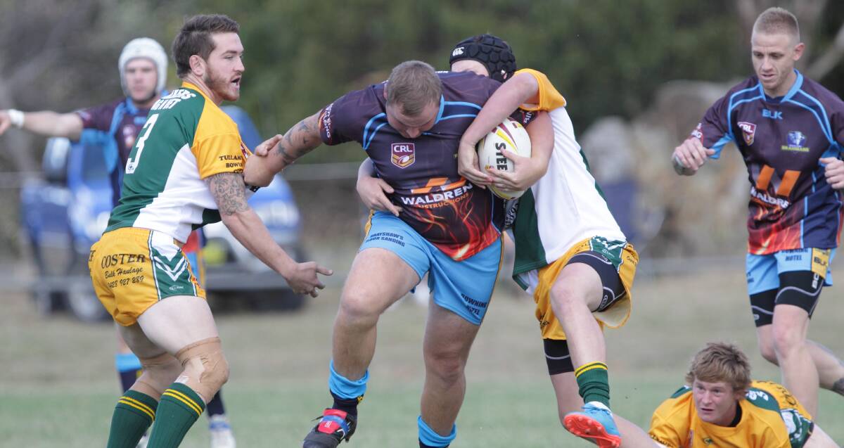 RAMPAGE: Brahmans prop Ben Potts runs riot through the Trundle Boomers. He was man of the match on Saturday as Binalong won all three home games. Picture: Susan Meli