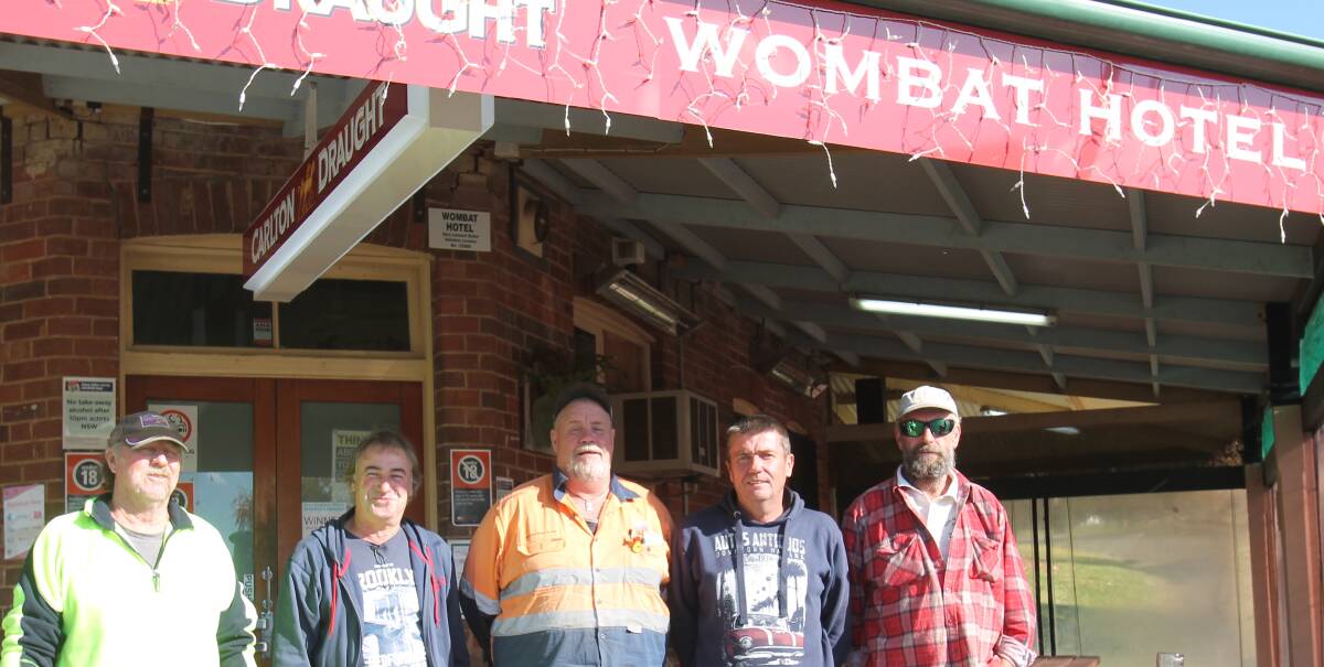 MEN AT WORK: Wombat Social Club president Marty Williams enjoys a hard-earned drink with fellow volunteers Jack Lemon, Brian Norris, Pat Wirth and Brett Wurth following the second annual local swap meet. Picture: Harrison Vesey