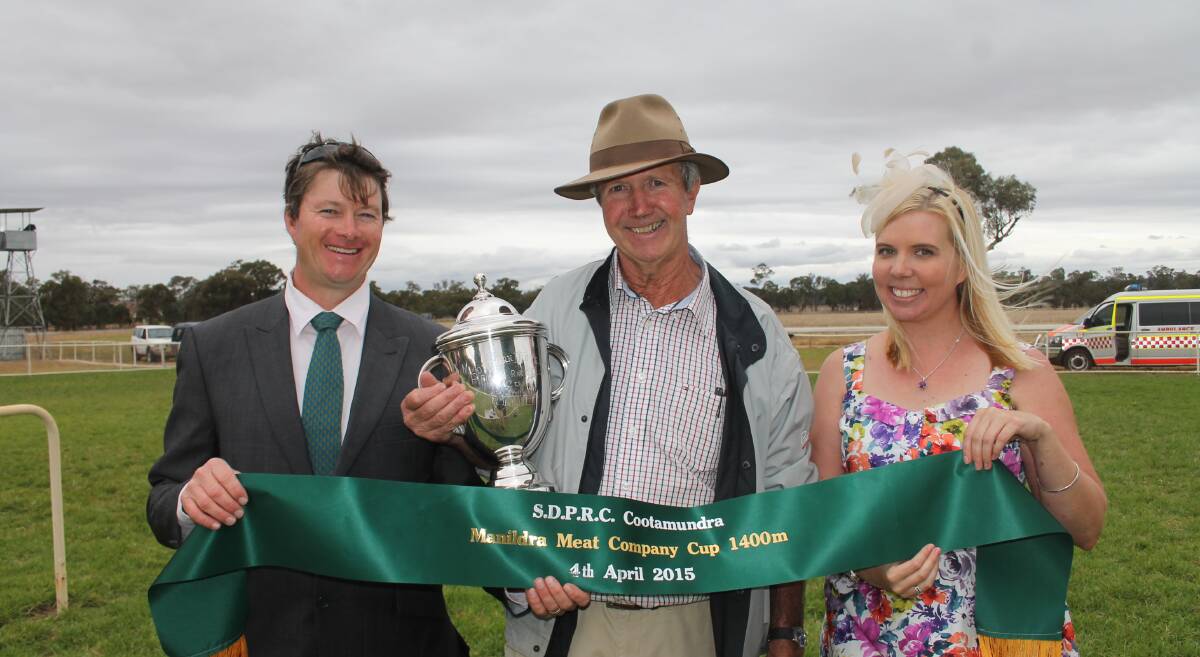 VICTORIOUS: Exchancellor's trainer and former Jugiong local Rodger Waters accepts the Coota Picnic Cup on Saturday.