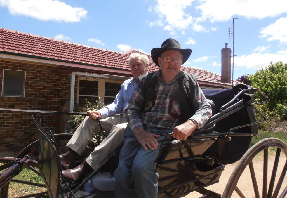 BIRTHDAY SURPRISE: Harold Packham with Keith Phillips enjoying a buggy ride around Harden for Harold's 95th birthday recently. Picture: Contributed