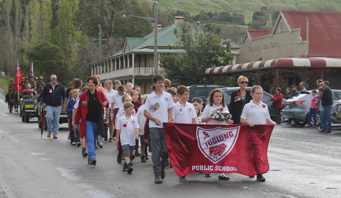 RESPECT: Jugiong Public School students lead the Anzac Day march in the village. 