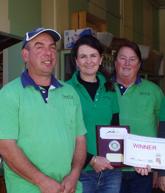 2014 WINNERS: Gino's Fruit and Veg were winners of the Best Business Award at last year's Chamber of Commerce Business Awards. Pictured are Gino and Jenny Polimeni with staff member Anne Ford. 