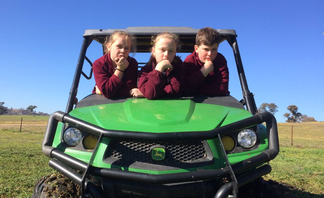 HAVING FUN: Jugiong Public School students Regan Manton, Tilly Coggan and Monty Hyles in Jugiong recently as part of the Kids Vs Art project creating a series of podcasts. Picture: Field Theory