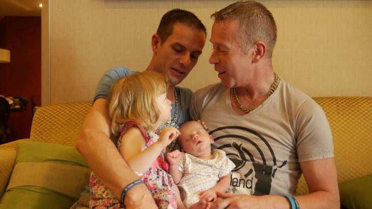 James, left, and Steven with Rhyley and two-year-old daughter Aleisha, in Bangkok. Photo: Am Sandford