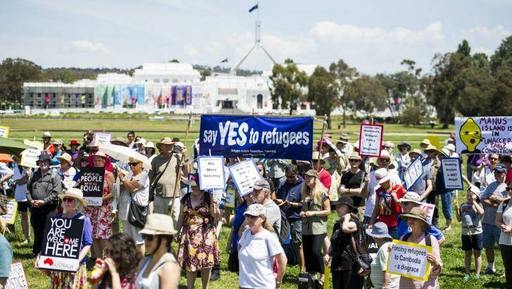 SUNDAY RALLY: Supporters of refugees' rights march to Parliament House. Photo: Jay Cronan