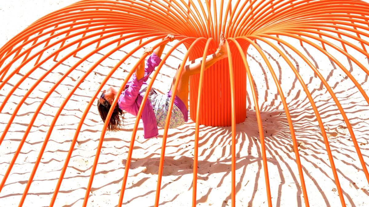 Rebecca Rose playing in her sculpture titled Sea Anemone. Photo: Steven Siewert.