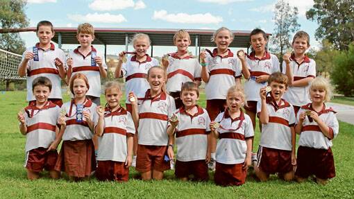 Trinity Catholic School's successful cross country runners are, back row, from left: Joie Whybrow, James Collins, Alice Henman, Hugh Squire-Wilson, Annabelle Ryan, Xavier Vasquez and Patrick Davis. Front row: Brody Schofield, Maddison Davis-Chard, Charlotte Synfield, Jetta Kennett, Chaz Cooper, Pippa Hufton, Christian Johnson and Sara Collins. 