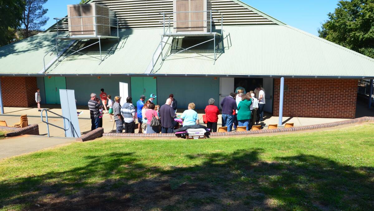 Queues have been a mark of the day at Junee High with smaller staff numbers believed to be responsible.