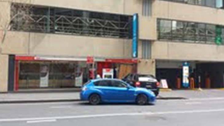 The Porsche was used to crash into the bank, while the blue Subaru WRX was used as the getaway car. Photo: Tyler White