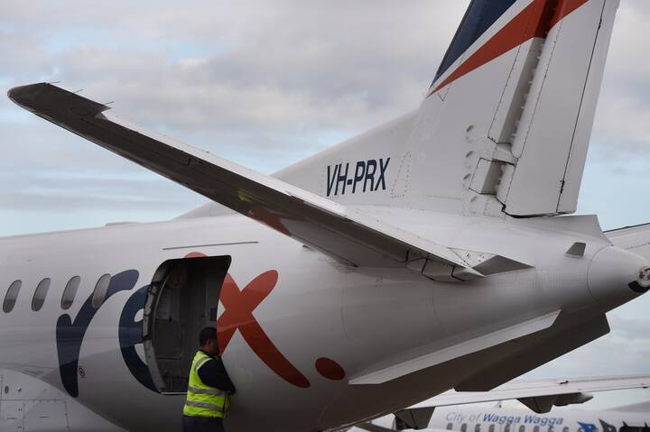 A REX Airlines plane at Sydney Airport. Picture by AAP Image/Dean Lewins