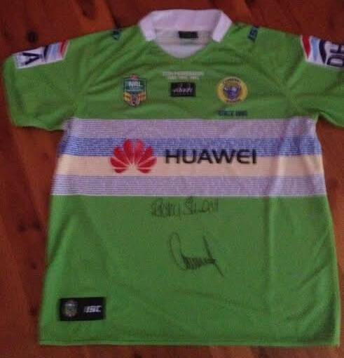 GREEN MACHINE: Going under the hammer at tonight's auction will be a signed Canberra Raiders jumper.