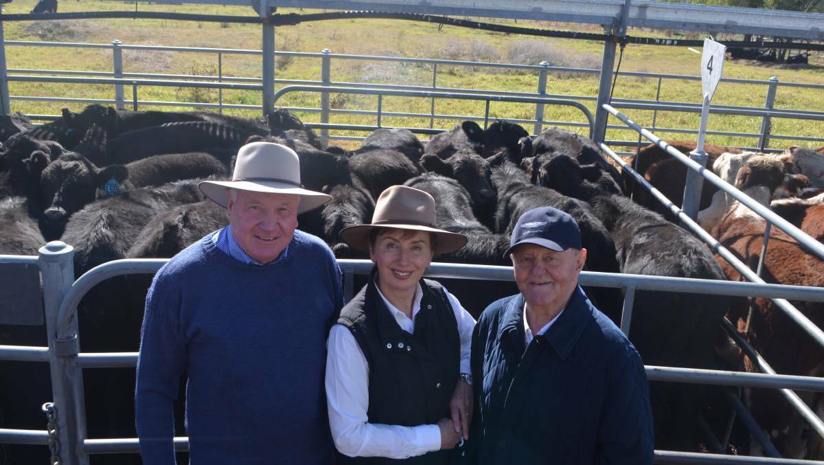 INFLUENTIAL FIGURE: Jim Renshaw, Jugiong, with Sue and Sam Chisholm, of Bundarbo Station at Jugiong, pictured at a cattle sale.