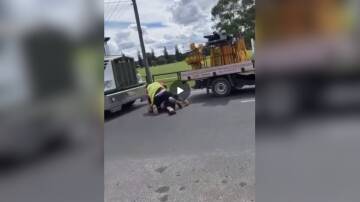 A still of the fight between a traffic controller and truck driver. Picture is from video