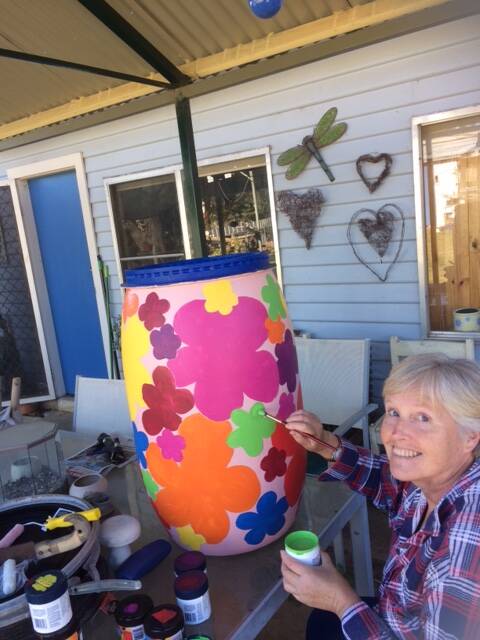 Eco friendly: Yvonne Whitechurch, painting one of the recycling bins that will be placed around the Handmade in Harden, Murrumburrah Community Markets.