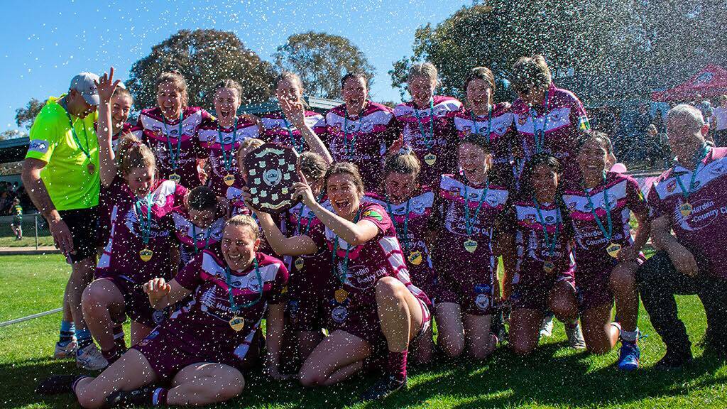 Celebatory Shower: Harden Hawkettes celebrate their premiership win over the Crookwell She-Devils in Canberra. Picture: Contributed