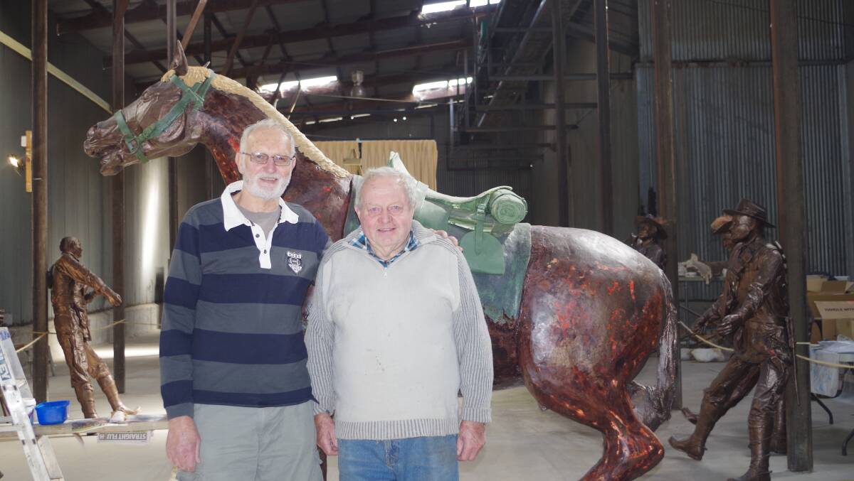 Terry Shanahan, grandson of Major Michael Shanahan, visits with sculptor Carl Valerius and shares some of his famous grandfather's history.