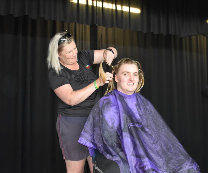Murrumburrah High School Year 11 student Brad Williams goes for the chop with local hairdresser Melissa Ings Picture: Jody Potts