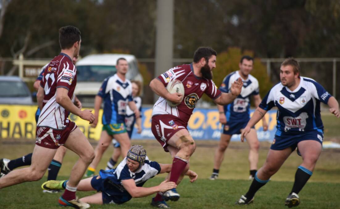 Chris Salway powers through the opposition during a recent Harden Hawks match.