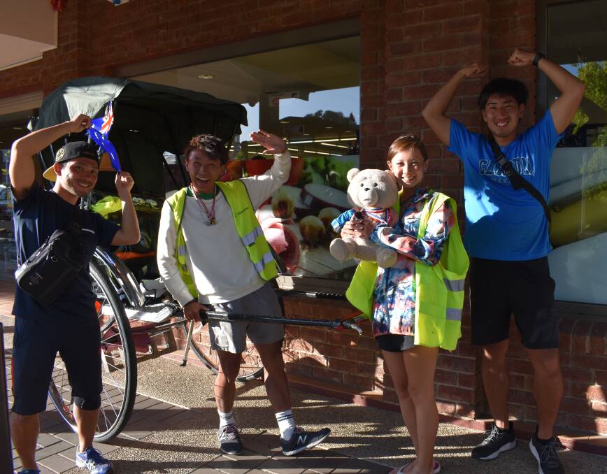Team Rickshaw: Suzuki, Atsu, Mayu and Riku outside Harden IGA on Monday evening. They hope to arrive in Melbourne by Christmas. Picture: Jody Potts