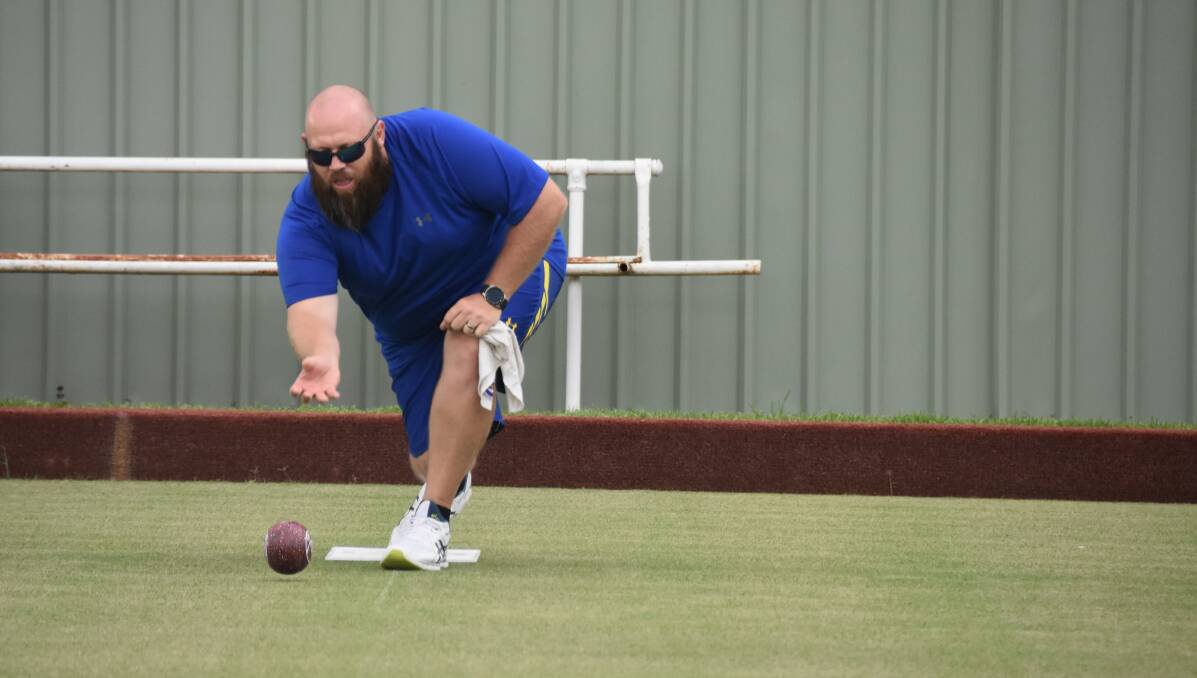 Matt Peisley enjoying a relaxed game of Mufti Bowls at the Harden Bowling Club. Matt, Barney and Cary won the game, but missed out on the chooks. Picture: Jody Potts