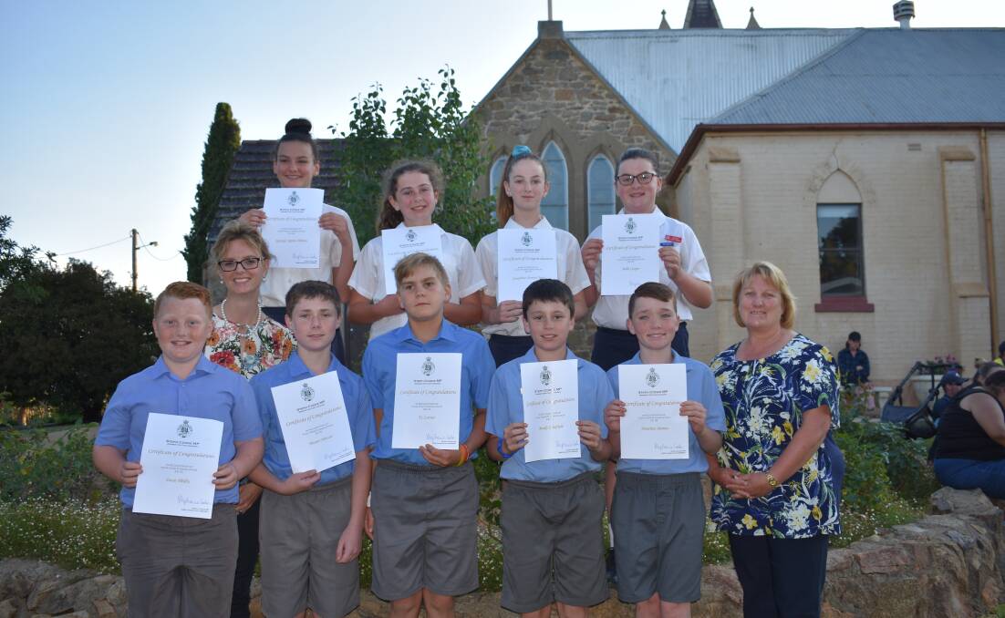 The Trinity Catholic School Year 6 graduating class with Member for Cootamundra, Steph Cooke, and Ms Donna Wade.