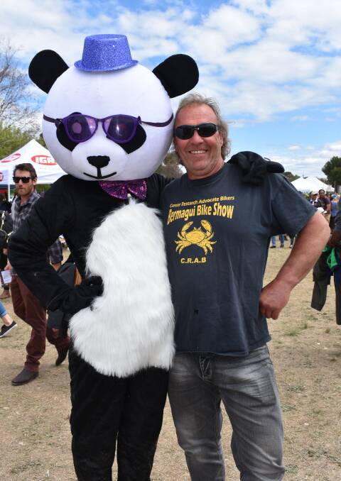 Panky the Panda hanging out with good mate Guy Turner. Panky was at the Kite Festival to raise awareness for 'Joan's wish' - an end to pancreatic cancer. Picture: Jody Potts