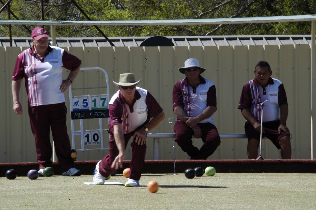 The boys watch on as Brian Gibson makes a shot during a recent match in Harden. Picture: Jody Potts