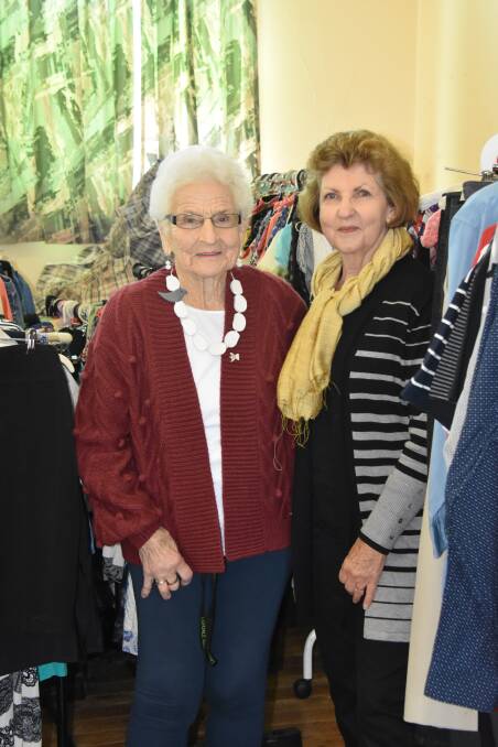 Anglican Op-Shop volunteers Rose Adler and Jan Gibson, surrounded by summer stock. Picture: Jody Potts