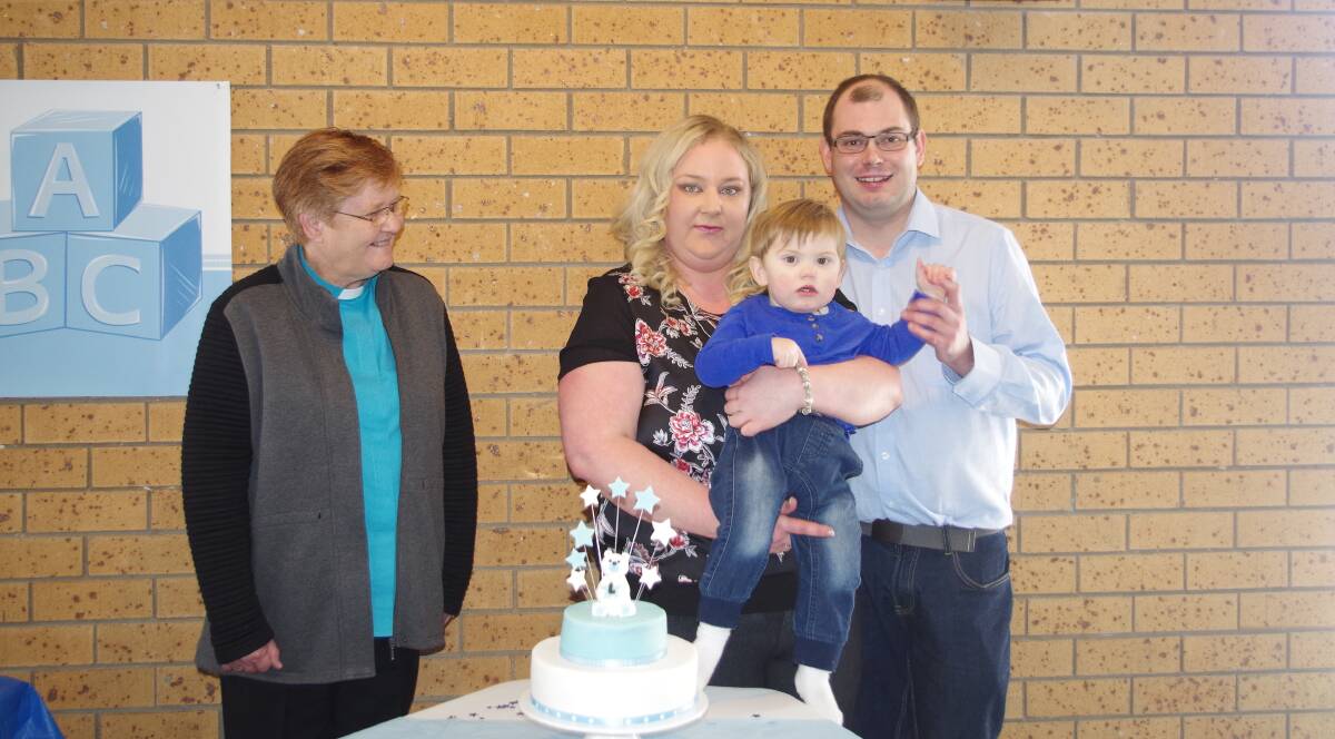 Rev. Colleen Close, Kylie, Liam and Adam Baldock at the Harden Bowling Club on Saturday, August 12 after Liam's christening at the Ross Memorial Uniting Church.