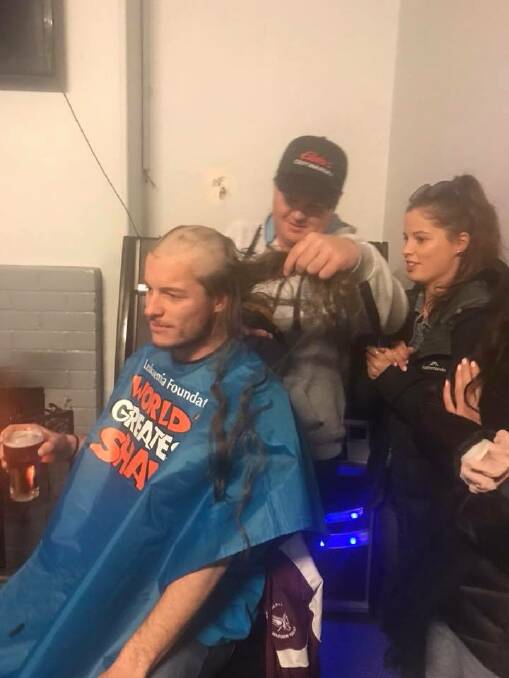 Tom's sister Georgie watches on while his brother Charlie wields the clippers at the Carrington Hotel. Picture Paula Butt
