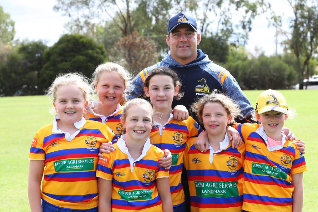COUNTRY BOY: Brumbies veteran Josh Mann-Rea with girls from Hay Cutters' Whipper Snippers Lotti Ryan, Sophie Tapper, Jessica Topper, Issi Homfrey, Zara Haddrill and Lara Strong. Picture: Emma Hillier
