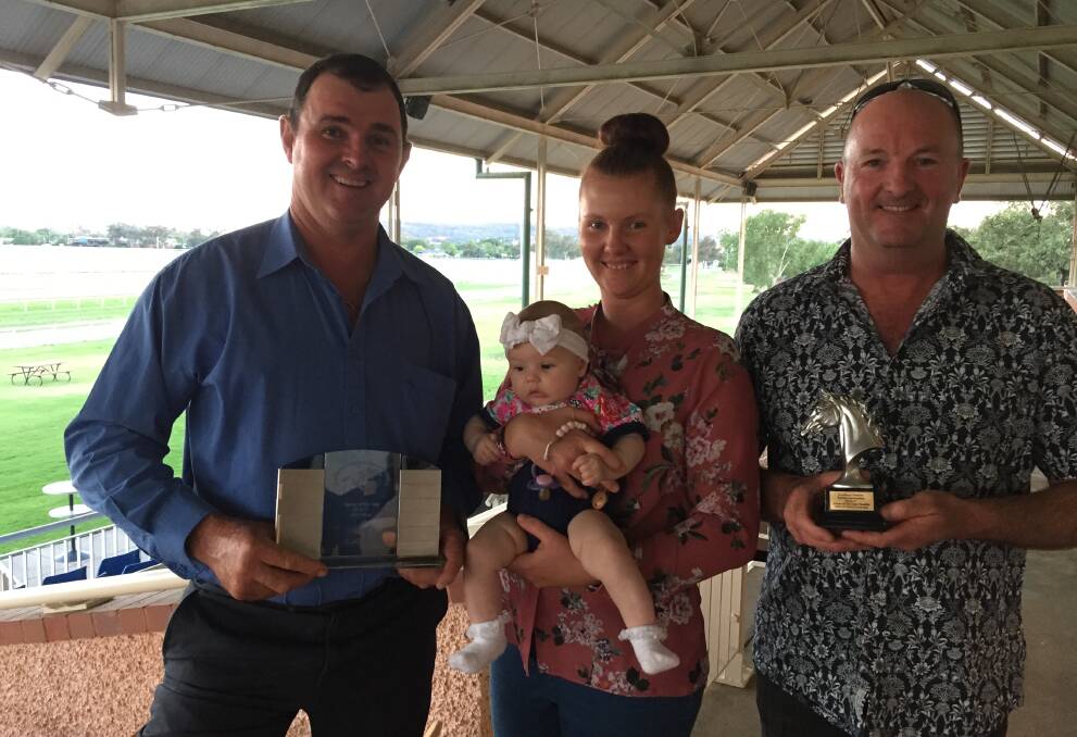 WINNERS: Wagga trainer Trevor Sutherland, wife Stephanie, daughter Dakota and owner Alan Cheney show off their awards for the trainer's premiership and Sweettalkingwilly's 2YO of the Year title on Wednesday night. Picture: Matt Malone
