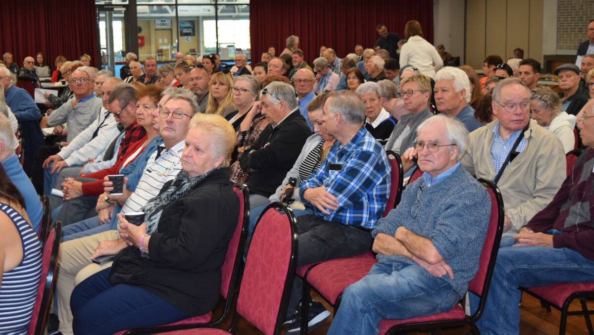 Worried faces: About 100 residents whose life savings are at risk met in Mandurah to get legal advice and weigh-up their options. Photo: Carla Hildebrandt.