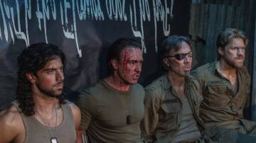 Kick Gurry, third from the left, wrote and directed C*A*U*G*H*T, about four Australian soldiers whose hostage video turns them into celebrities. Picture Stan