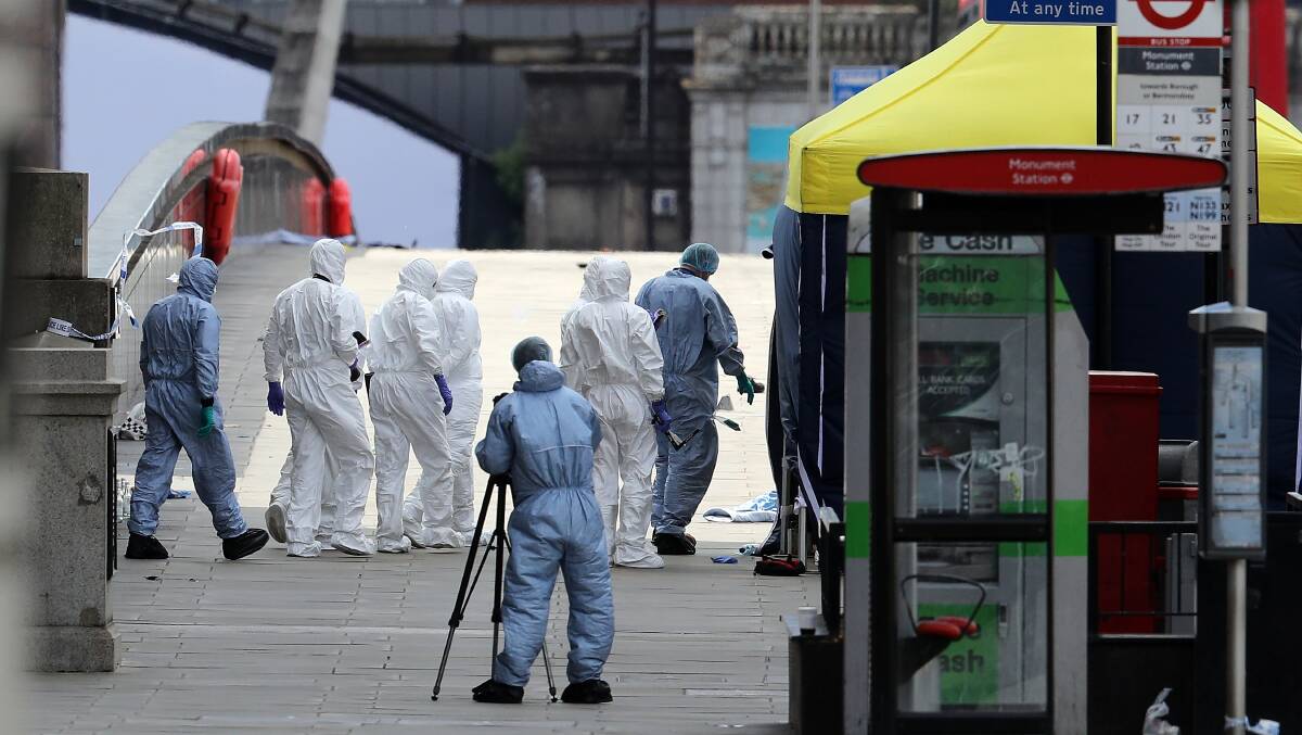 Forensic officers work on London Bridge after the terrorist attack in London, England. Photo: Getty Images
