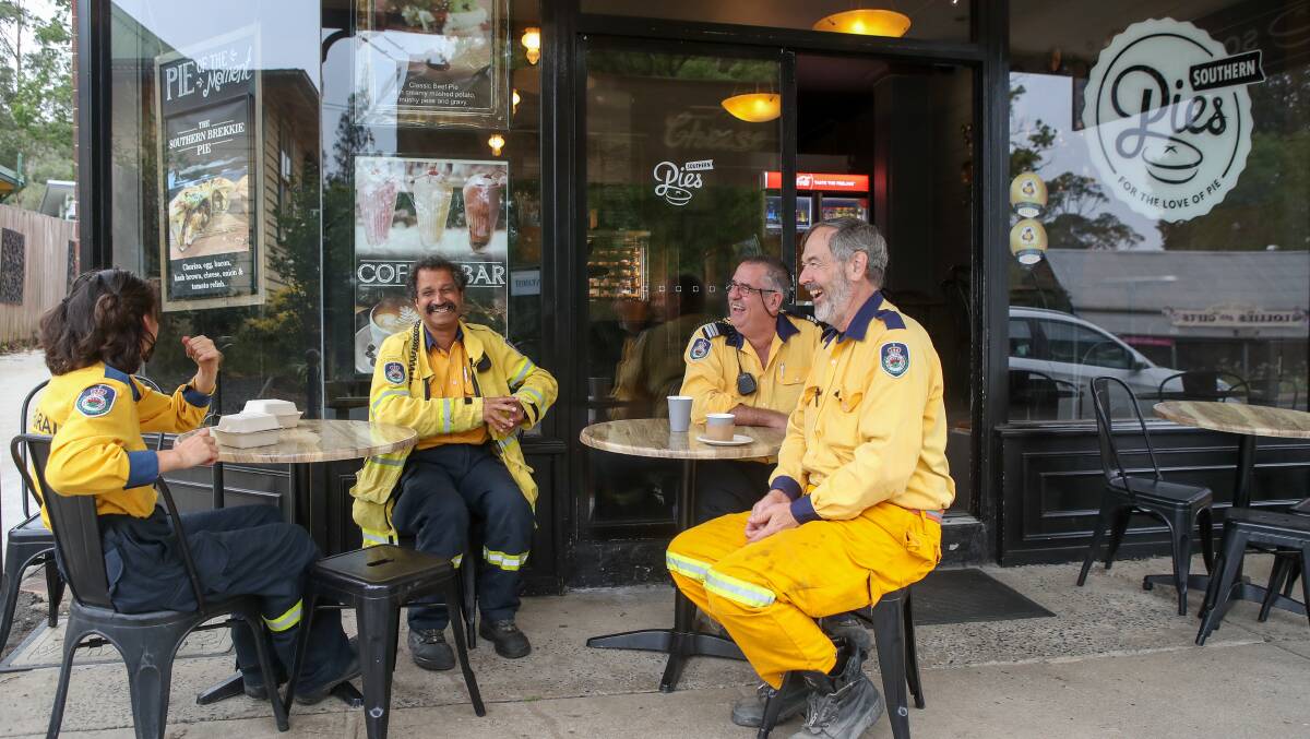 RFS members from the Illawarra Stike Team taking a break in Kangaroo Valley after fire tore through the area January 4. Picture by Adam McLean RFS members from the Illawarra Stike Team taking a break in Kangaroo Valley after fire tore through the area January 4. Picture by Adam McLean